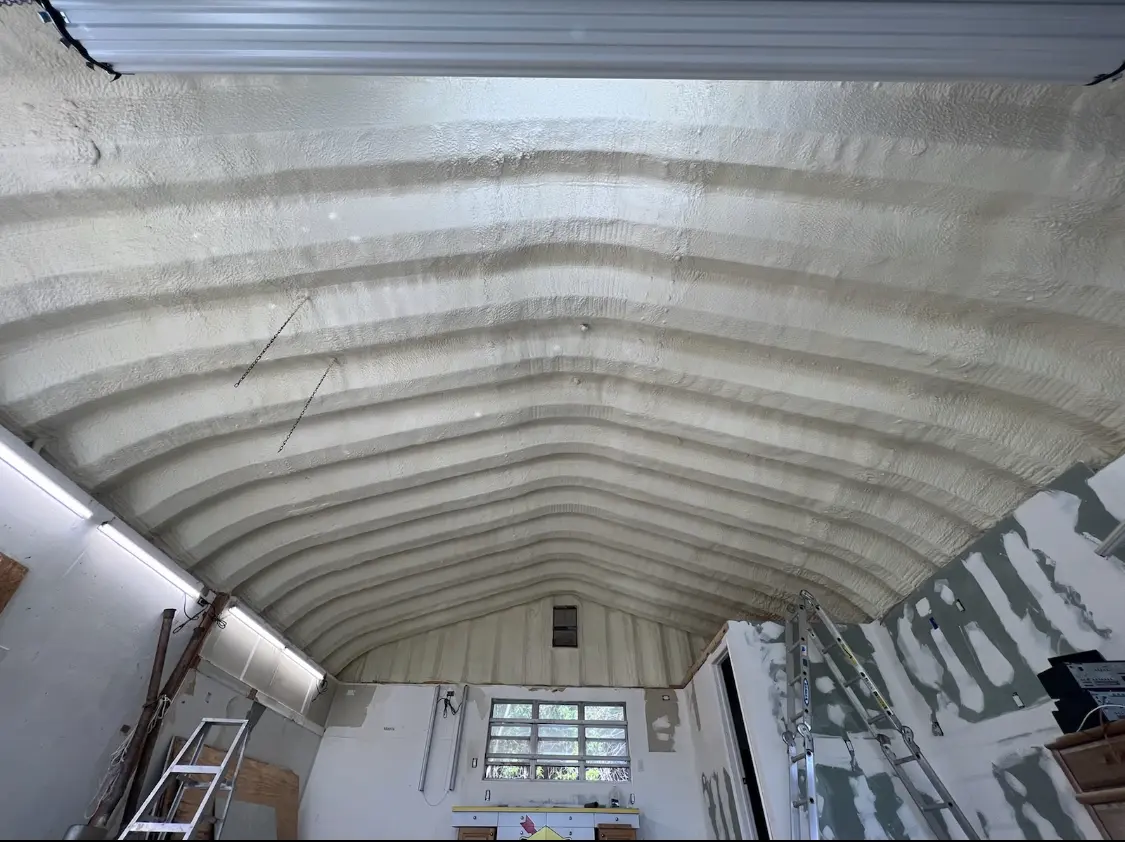 Spray polyurethane foam applied to the underside of a metal roof deck in Ellisville
